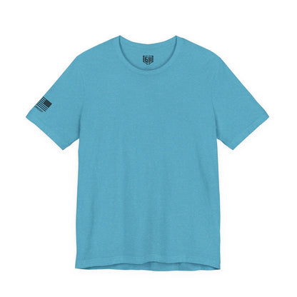Blue t-shirt with a US Flag and small logo on the sleeve against a white background