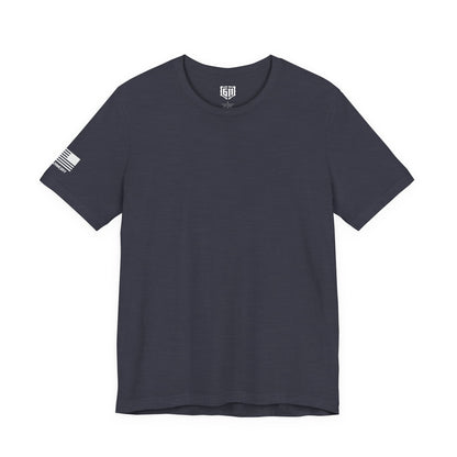 Navy blue t-shirt with a small logo on the sleeve against a white background