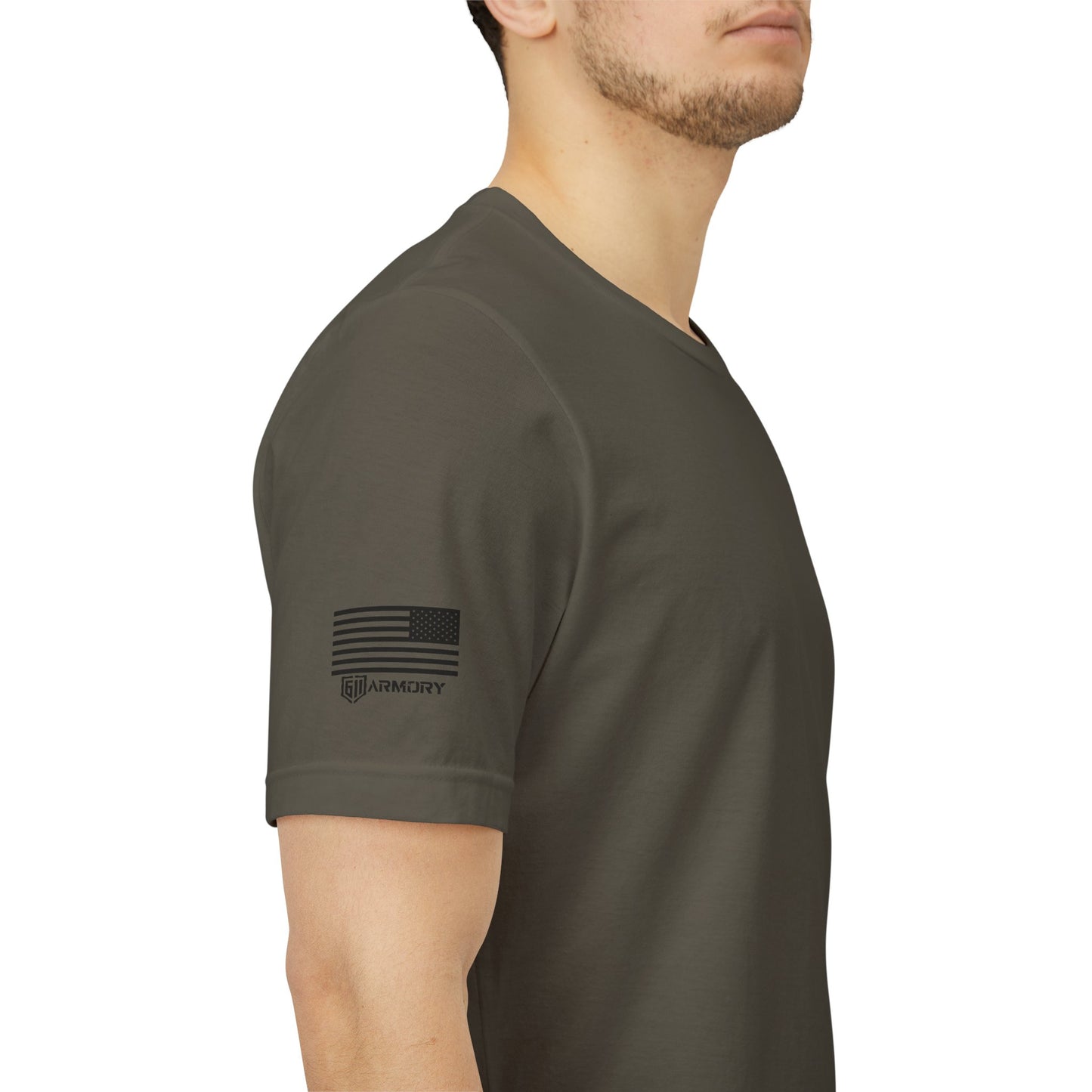 Person wearing a dark green t-shirt with a logo on the sleeve against a white background