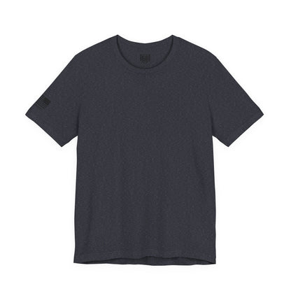 Heather Navy t-shirt with a Flag and logo on the sleeve against a white background