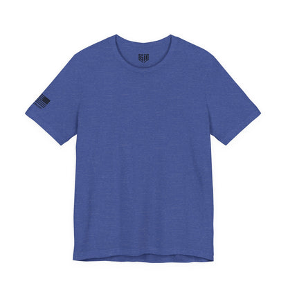 Blue t-shirt with a small logo on the sleeve against a white background
