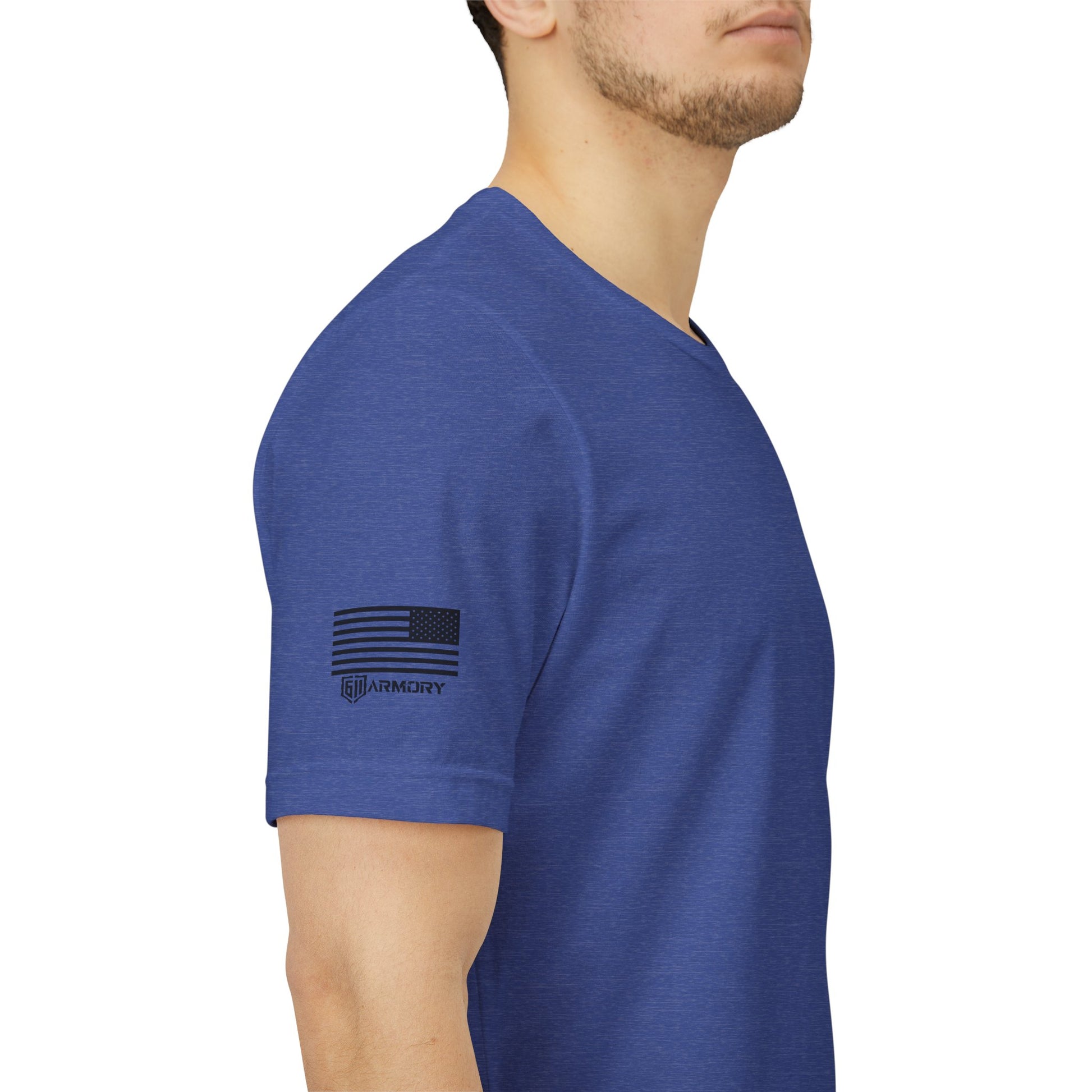 Blue t-shirt with a logo on the sleeve worn by a person against a white background