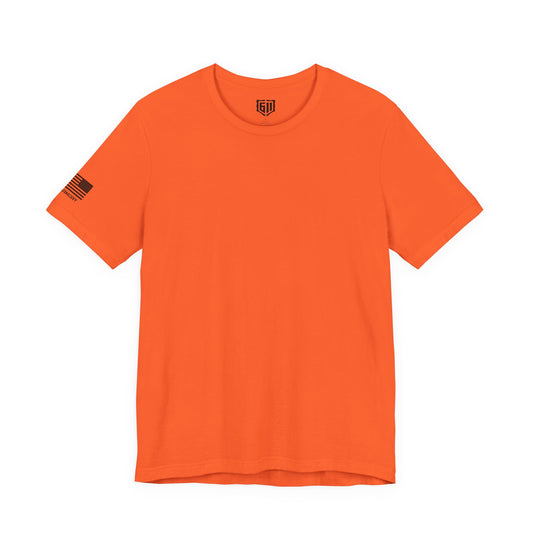 Orange t-shirt with a small logo on the sleeve against a white background