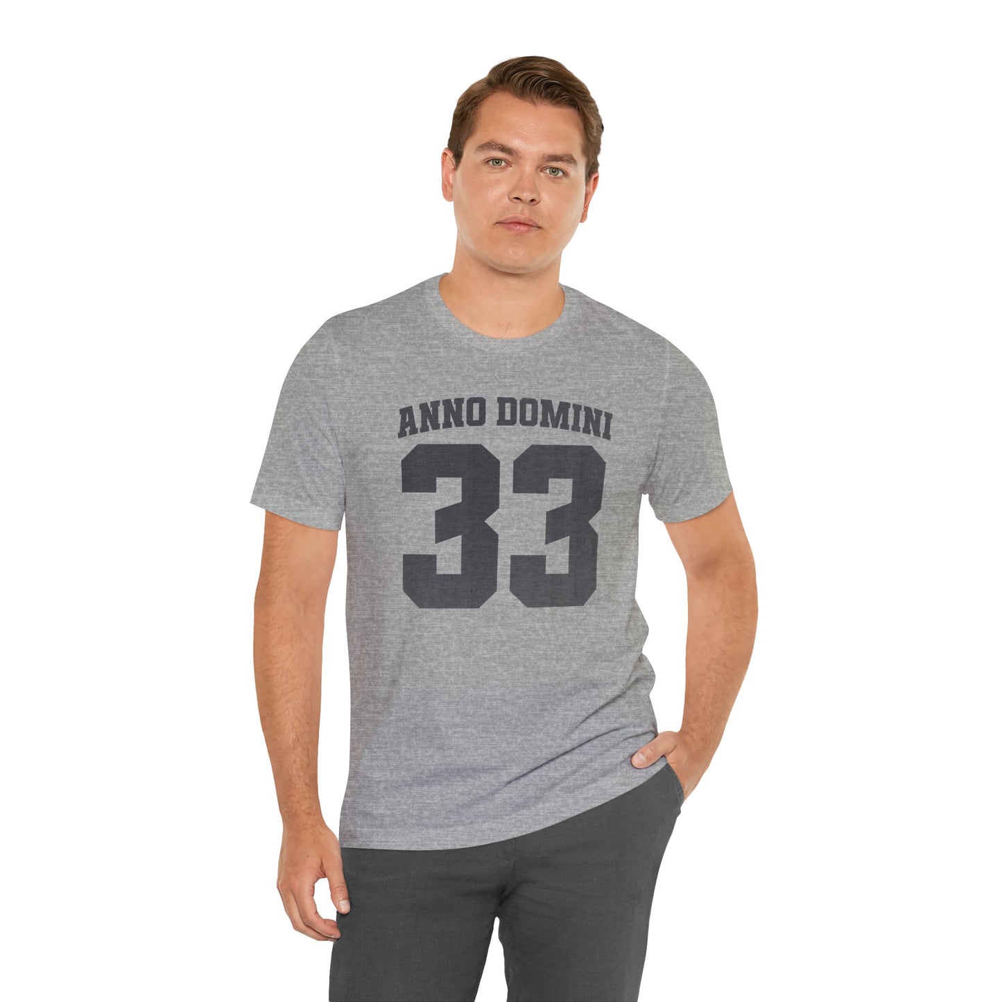 Man wearing a gray t-shirt with 'ANNO DOMINI 33' text on a white background