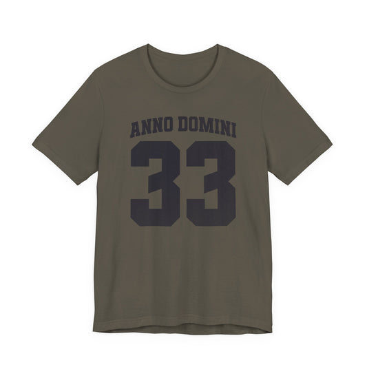 Green t-shirt with 'Anno Domini 33' text on a white background