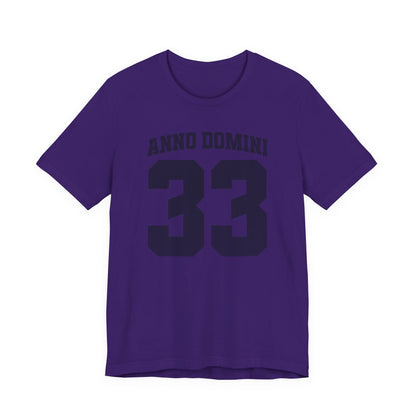 Purple t-shirt with 'ANNO DOMINI 33' text on a white background