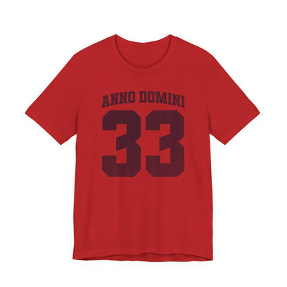 Red t-shirt with 'ANNO DOMINI 33' text on a white background