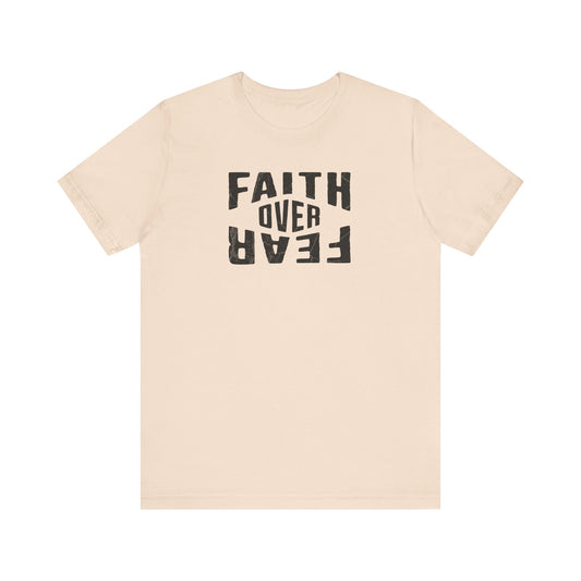Beige t-shirt with 'Faith Over Fear' text on a white background