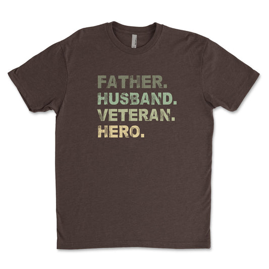 A brown t-shirt with the text 'Father, Husband, Veteran, HERO' printed in a camouflage pattern.