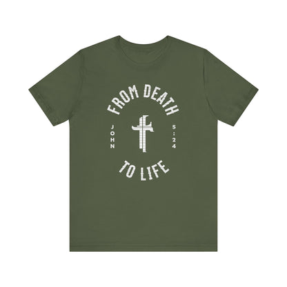 Green t-shirt with white text and cross design on a white background