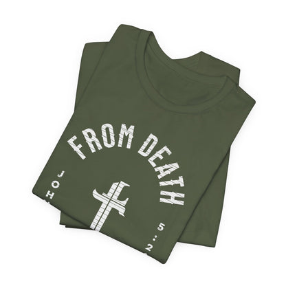 Folded green t-shirt with 'From Death' text and cross design on a white background