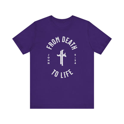 Purple t-shirt with white text and cross design on a white background