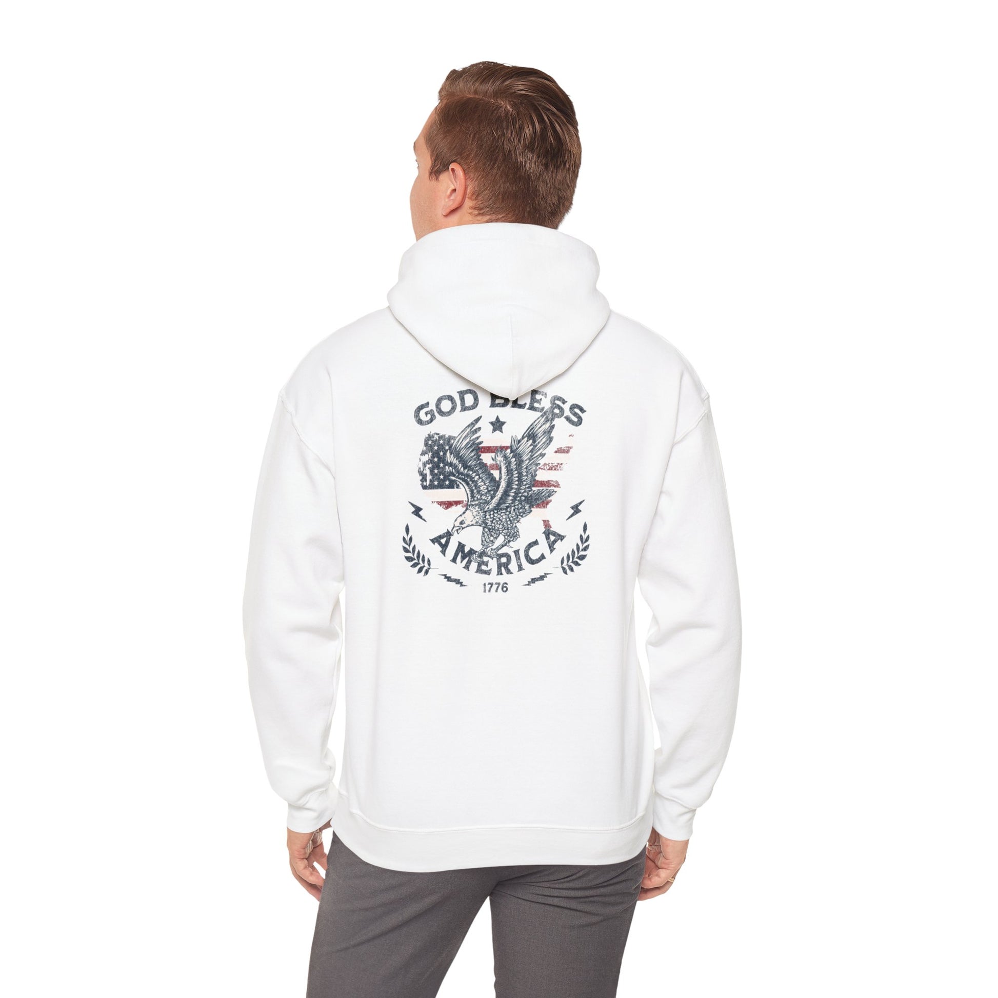 A person wearing a white hooded sweatshirt with 'God Bless America' printed on the back.
