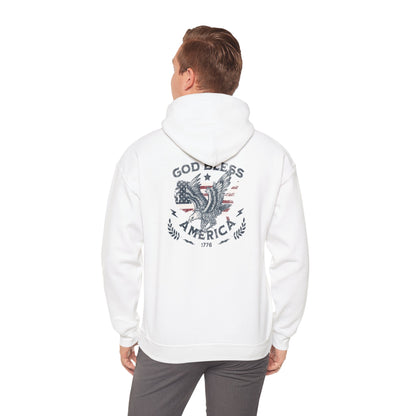 A person wearing a white hooded sweatshirt with 'God Bless America' printed on the back.