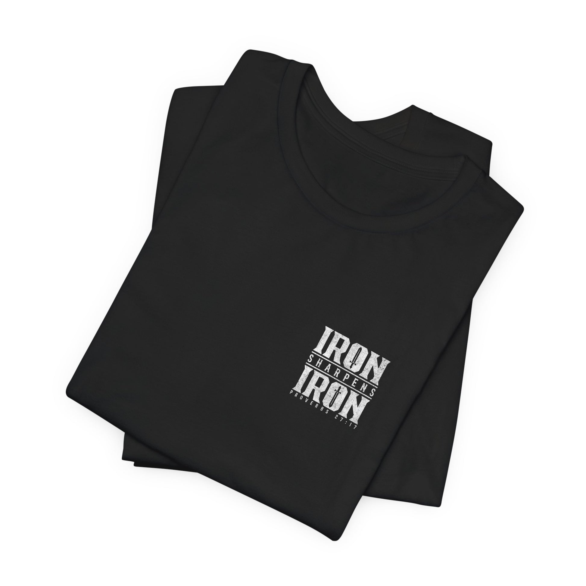 Folded black t-shirt with 'IRON' text on a white background