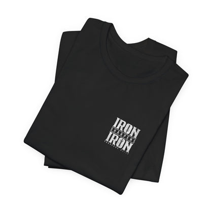 Folded black t-shirt with 'IRON' text on a white background