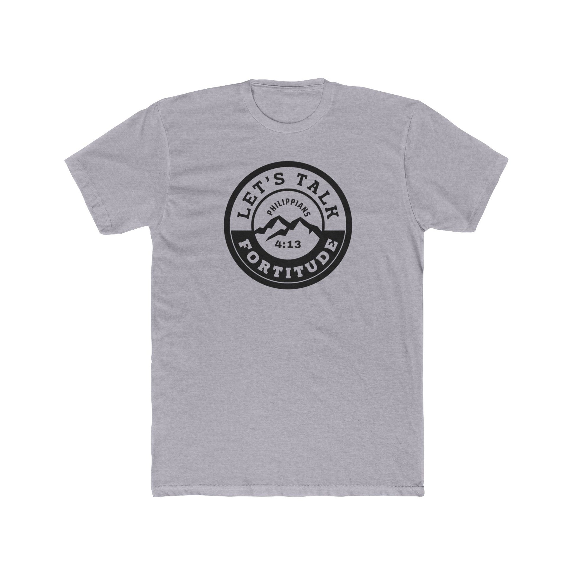 A beige t-shirt with a circular black logo print containing text and a mountain and sunset graphic in the center.