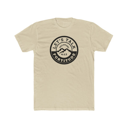 A beige t-shirt with a circular black logo print containing text and a mountain and sunset graphic in the center.
