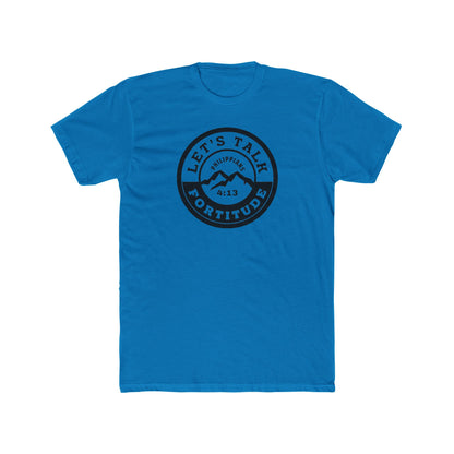 A beige t-shirt with a circular black logo print containing text and a mountain and sunset graphic in the center.