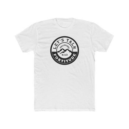A beige t-shirt with a circular black logo print containing text and a mountain and sunset graphic in the center.